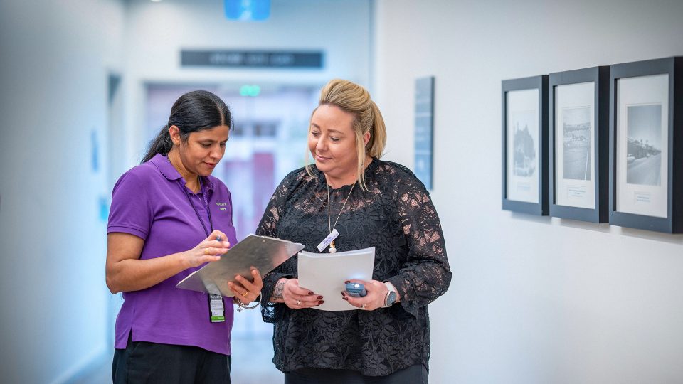 CAREERS Lifestyle Coordinator discussing activity plans with another staff member for the next month in a residential aged care home